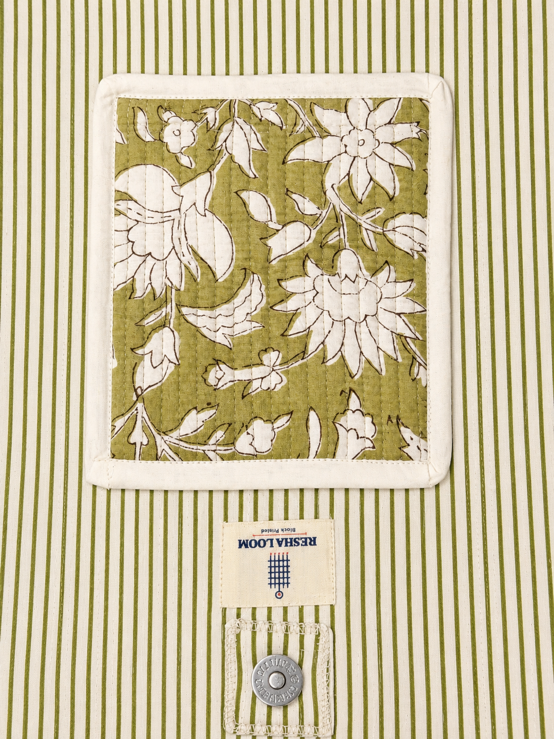 Inside of the bag with olive green stripes and floral compartment 